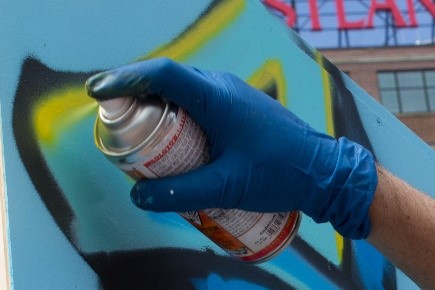 GRAFFITI ARTIST AT WORK – STREET FAIR IN PORTLAND, MAINE photo by Larry Cotton